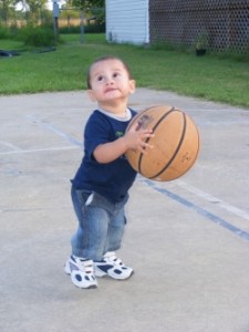 Little kid playing basketball